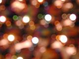 Festive background of colorful sparkling party lights in a soft bokeh pattern in a full frame view