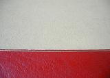 Top down close up on red and white book cover with fine leather type texture and copy space