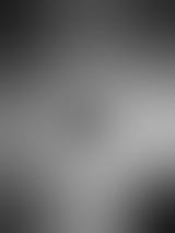 Defocused or blurred abstract background with copy space on circular gradient with grey shades