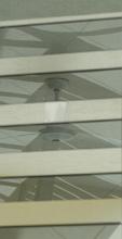 Abstract close up of reflections of ceiling in windows with multiple horizontal lines with copy space