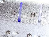 Extreme close up of computer light flashing purple with icons including cylinder and boxes