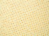 Extreme close up on yellow halftone dots with slight variance of radius as full frame abstract background