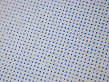 Abstract background composed of blue dots with yellow highlights on white