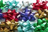 Collection of colorful decorative bows in shiny ribbon for decorating and wrapping gifts for festive occasions