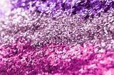 colorful purple and pink glitter poured into rows