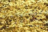a background of gold coloured glitter in closeup