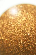 a sparkling gold coloured glitter backgorund