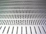 Unusual background with close up view of plastic grate with many slits closely spaced and placed in rows