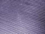 Long parallel purple metal diagonal lines as full frame background with copy space