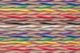 Detail view on bonded spindle of electrical wire in blue, green, yellow, orange, black, red, yellow and white