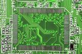 Detail view on green and white printed circuit board with computer chips and copy space