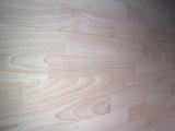 a light coloured wood laminate floor