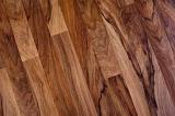 angled image of a polished dark wood floor