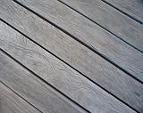 diagonal wood decking boards sun bleeched with cracks