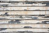 wood weather board cladding planks with flaked paint