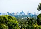 Adelaide city CBD from the distant lush forest and hinterland of the hills.