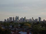 view of melbourne CBD across rooftops in the suburbs
