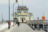People on the St Kilda Pier, St Kilda, Victoria, Australia with a view towards the historic pavilion at the end
