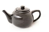 Shiny isolated bulbous ceramic teapot for serving and brewing tea, side view on white