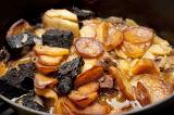 Lancashire Hot Pot, a traditional stew of beef or lamb with potatoes cooked in a pot or crock, close up of the prepared meal