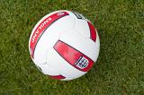 White England soccer ball or football with the English emblem to support the team on a black background with copyspace