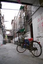 Bicycles parked in a narrow Chinese back street or alley used as urban transport for commuting