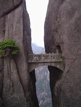 Beautifully Carved Stone Arch Bridge Through Granite Tunnels and Across Gap in Huangshan Mountains in Eastern China