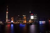 Skyline of Shanghai at Night Featuring Oriental Pearl TV Tower and View of Boats Traveling on Huangpu River - City Lights of Shanghai, China at Night
