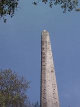 Needle of Cleopatra, Ancient Egyptian obelisk and landmark rebuilt in London, UK, under a clear blue sky