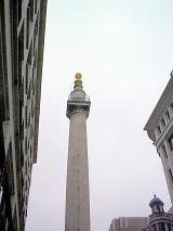 Low Angle View of Monument to the Great Fire of London Fluted Doric Column, a Landmark in City of London, England Against Overcast Sky