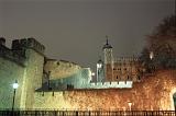 A night time view of the tower of london illuminated by floodlights