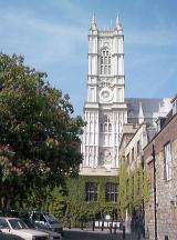 White Tower of Historical Gothic Westminster Abbey with Facade Covered in Climbing Plant Ivy on Sunny Day, London, England