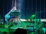 Colorful illuminated green centre stage at a circus performance with spotlights and smoky atmosphere in an entertainment concept