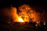 Spectators watching a blazing bonfire while celebrating Bonfire Night or Guy Fawkes on the 5th November
