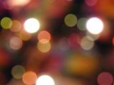Festive background bokeh of colorful party lights celebrating a special event or seasonal holiday, full frame