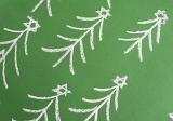 Chalk hand-drawn Christmas trees forming a diagonal pattern on a green chalkboard for a festive Xmas background