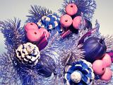 Colorized Close Up of Glittering Festive Christmas Decoration Made from Imitation Metallic Evergreen Sprigs and Pine Cones
