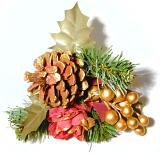 Christmas decoration with a cone and fake gold berries with leaves and pine branches over a white background