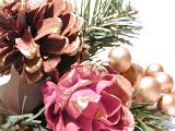Extreme Close Up Detail of Festive Christmas Decoration Made from Gold Painted Pine Cones, Evergreen Sprigs and Ornamental Balls