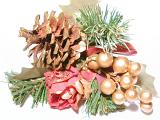 Close up of Christmas decoration with pine cone, tree sprigs, god berries and red ribbon on white background