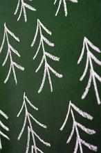 Full frame close up of tree icons drawn in chalk on a green background