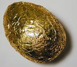 a gold foil wrapped chocolate easter egg
