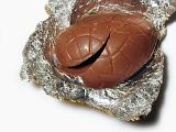 a chocolate easter egg broken open ready to eat