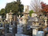 column headstones in a japanese style graveyard in tokyo, japan
