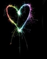 a rainbow flag coloured sparking love heart
