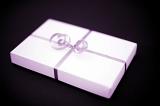 a pink wrapped gift with ribbon and bow