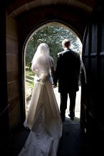 the bride and bridgegroom walking out of a church after the wedding has taken place