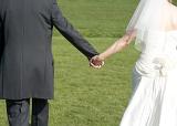 background image of the wedding bride and groom holding hands