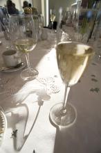 glasses full of wine on a wedding reception table