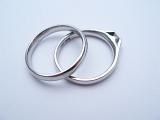 two wedding rings on a light coloured background